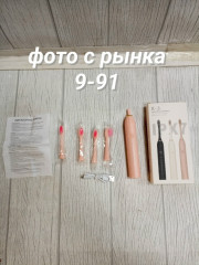 Электрическая зубная щетка